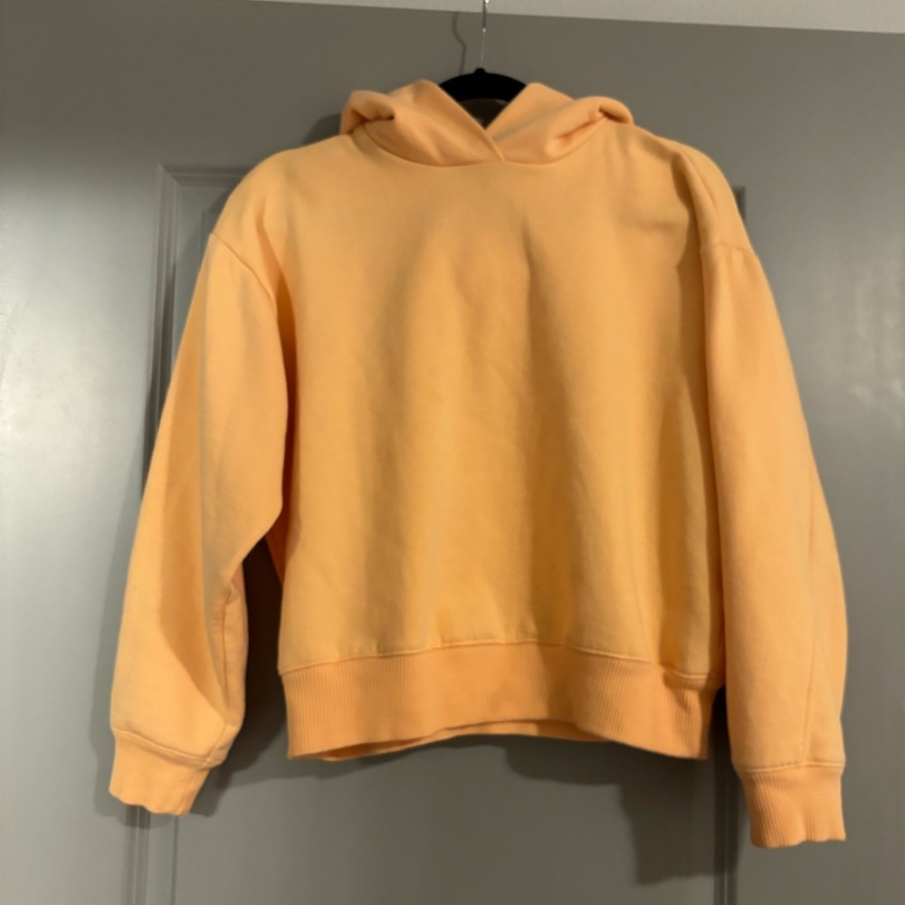 Pastel orange sweatshirt